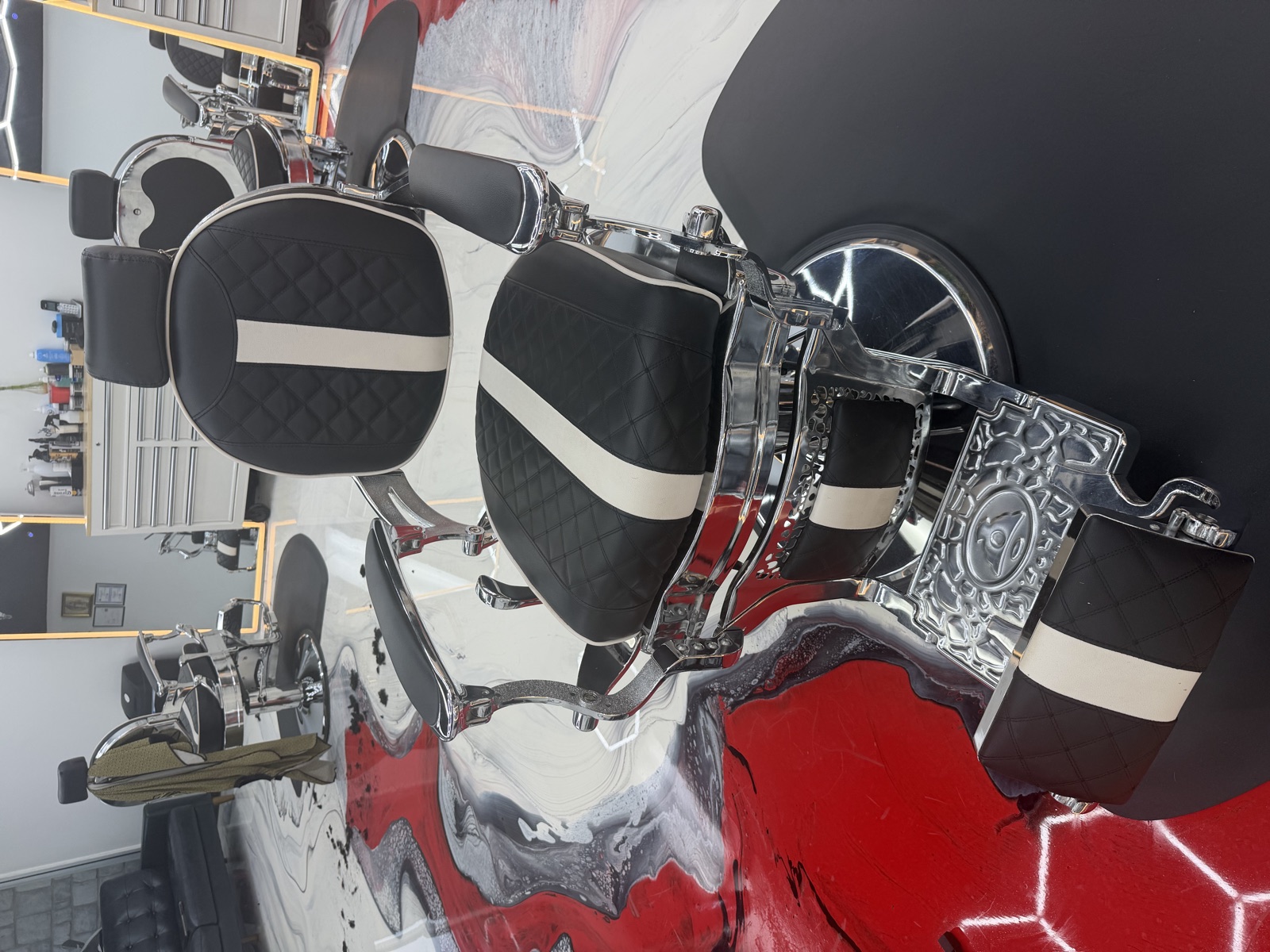 Vintage chrome and black leather barber chair at Catrines