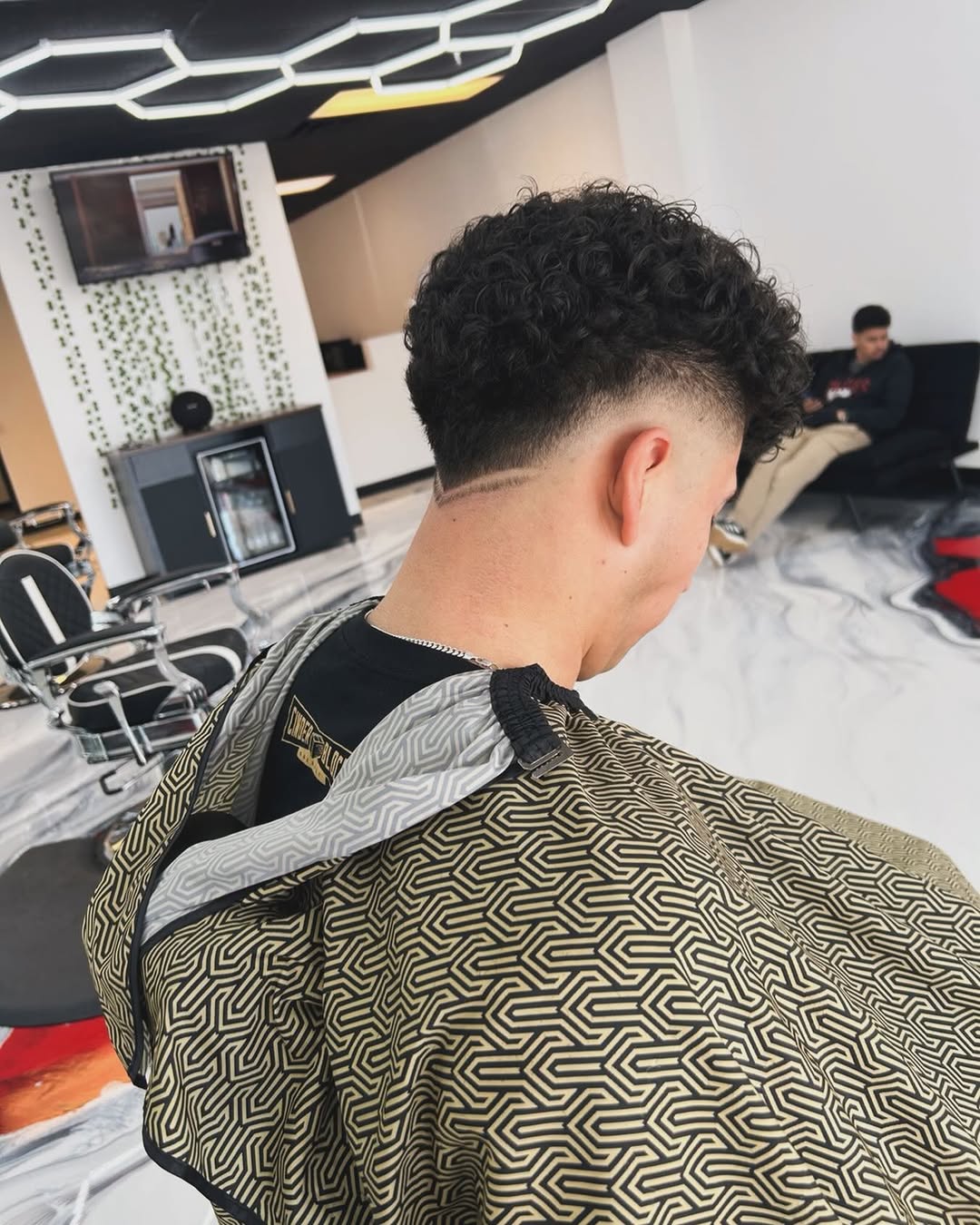 Curly back with clean fade